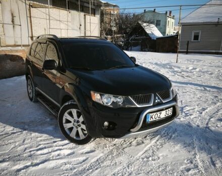 Черный Мицубиси Аутлендер, объемом двигателя 2 л и пробегом 304 тыс. км за 6500 $, фото 1 на Automoto.ua