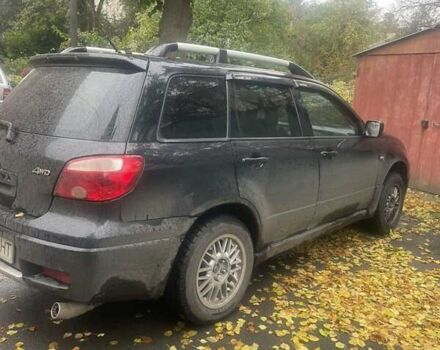 Чорний Міцубісі Аутлендер, об'ємом двигуна 2 л та пробігом 260 тис. км за 5300 $, фото 1 на Automoto.ua