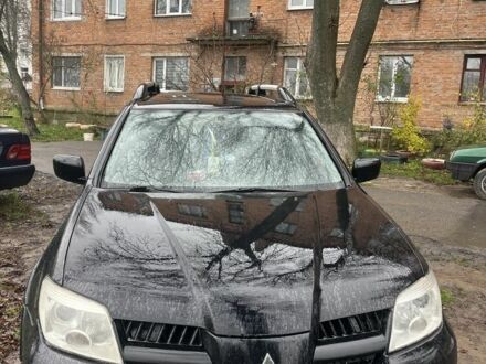 Черный Мицубиси Аутлендер, объемом двигателя 2 л и пробегом 430 тыс. км за 4300 $, фото 1 на Automoto.ua