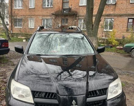 Чорний Міцубісі Аутлендер, об'ємом двигуна 2 л та пробігом 430 тис. км за 4300 $, фото 1 на Automoto.ua