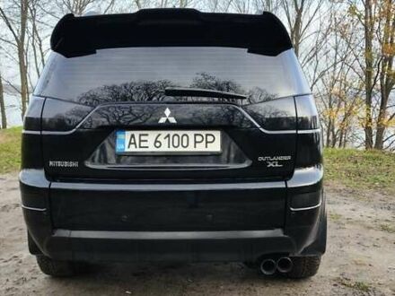 Черный Мицубиси Аутлендер, объемом двигателя 3 л и пробегом 190 тыс. км за 10000 $, фото 1 на Automoto.ua