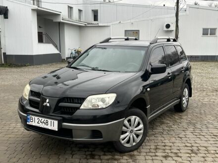 Чорний Міцубісі Аутлендер, об'ємом двигуна 2 л та пробігом 220 тис. км за 6299 $, фото 1 на Automoto.ua