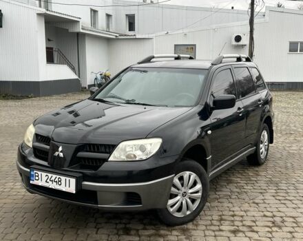 Чорний Міцубісі Аутлендер, об'ємом двигуна 2 л та пробігом 220 тис. км за 6299 $, фото 1 на Automoto.ua