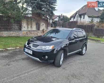 Черный Мицубиси Аутлендер, объемом двигателя 3 л и пробегом 220 тыс. км за 9000 $, фото 1 на Automoto.ua