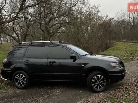 Чорний Міцубісі Аутлендер, об'ємом двигуна 2.38 л та пробігом 215 тис. км за 5800 $, фото 1 на Automoto.ua