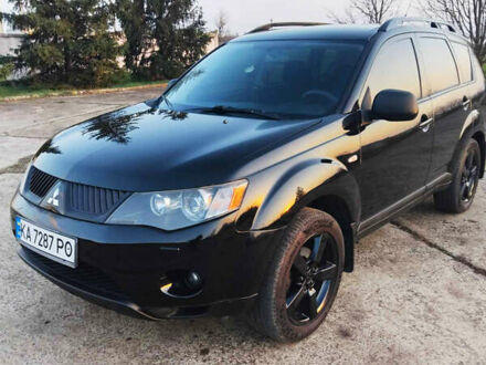 Черный Мицубиси Аутлендер, объемом двигателя 3 л и пробегом 225 тыс. км за 9200 $, фото 1 на Automoto.ua