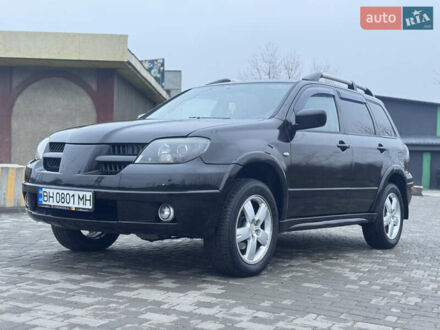Чорний Міцубісі Аутлендер, об'ємом двигуна 2.38 л та пробігом 202 тис. км за 5800 $, фото 1 на Automoto.ua