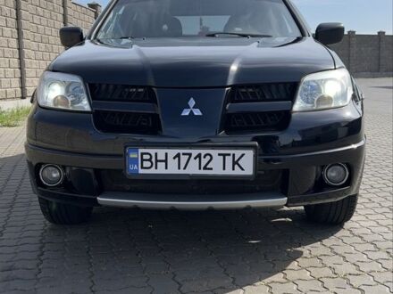 Мицубиси Аутлендер 2007 в Черноморске (Ильичевске) на Automoto.ua Черный Мицубиси Аутлендер, объемом двигателя 2.4 л и пробегом 265 тыс. км за 7200 $, фото 1 на Automoto.ua