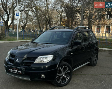Черный Мицубиси Аутлендер, объемом двигателя 2.4 л и пробегом 320 тыс. км за 5999 $, фото 1 на Automoto.ua