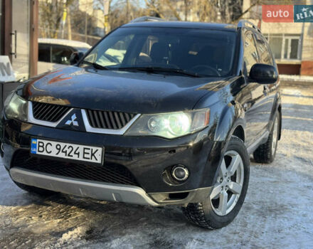 Черный Мицубиси Аутлендер, объемом двигателя 2.36 л и пробегом 265 тыс. км за 8500 $, фото 1 на Automoto.ua