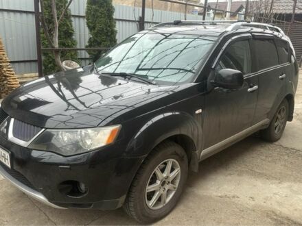 Черный Мицубиси Аутлендер, объемом двигателя 2.4 л и пробегом 240 тыс. км за 8500 $, фото 1 на Automoto.ua