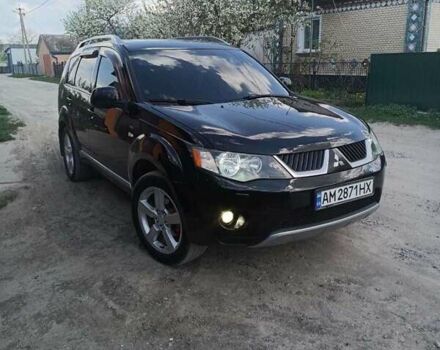 Черный Мицубиси Аутлендер, объемом двигателя 3 л и пробегом 200 тыс. км за 7999 $, фото 1 на Automoto.ua