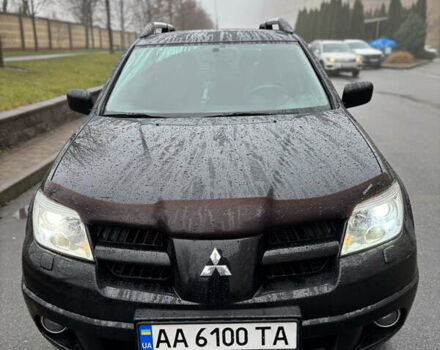 Чорний Міцубісі Аутлендер, об'ємом двигуна 2.4 л та пробігом 169 тис. км за 8000 $, фото 1 на Automoto.ua