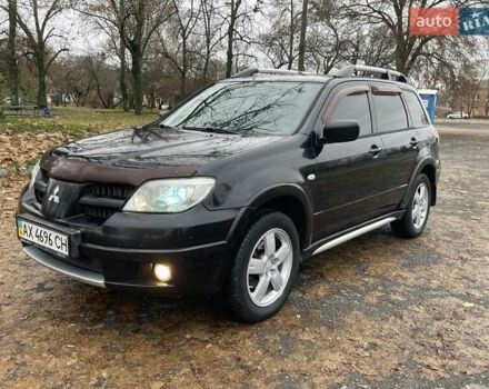 Чорний Міцубісі Аутлендер, об'ємом двигуна 2.4 л та пробігом 213 тис. км за 6850 $, фото 1 на Automoto.ua