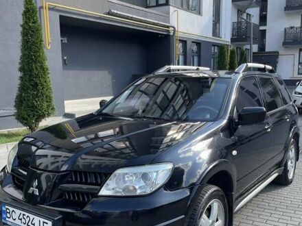 Чорний Міцубісі Аутлендер, об'ємом двигуна 2.38 л та пробігом 310 тис. км за 7500 $, фото 1 на Automoto.ua
