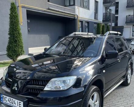 Черный Мицубиси Аутлендер, объемом двигателя 2.38 л и пробегом 310 тыс. км за 7500 $, фото 1 на Automoto.ua