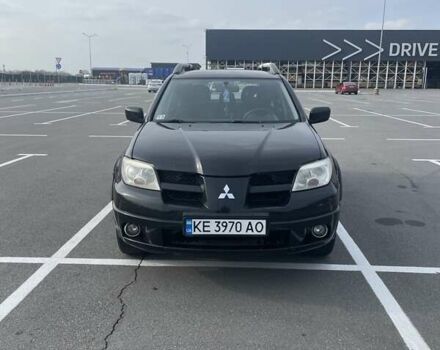 Черный Мицубиси Аутлендер, объемом двигателя 2.38 л и пробегом 180 тыс. км за 6900 $, фото 1 на Automoto.ua