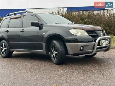 Черный Мицубиси Аутлендер, объемом двигателя 2 л и пробегом 295 тыс. км за 5300 $, фото 1 на Automoto.ua