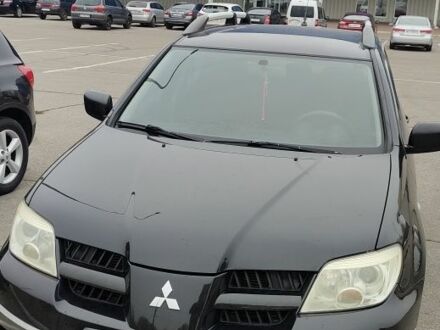 Чорний Міцубісі Аутлендер, об'ємом двигуна 2 л та пробігом 175 тис. км за 7800 $, фото 1 на Automoto.ua