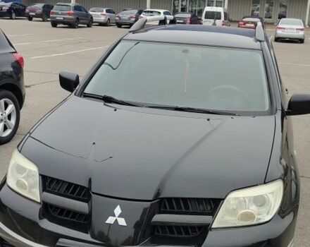 Чорний Міцубісі Аутлендер, об'ємом двигуна 2 л та пробігом 175 тис. км за 7800 $, фото 1 на Automoto.ua