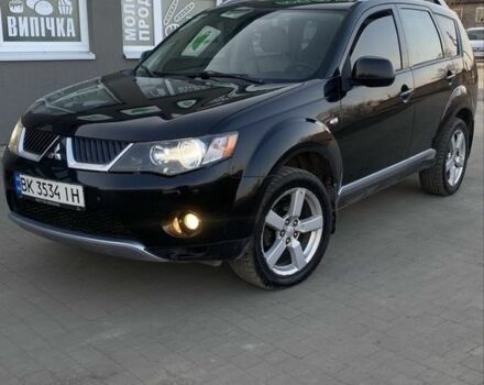 Черный Мицубиси Аутлендер, объемом двигателя 2.4 л и пробегом 200 тыс. км за 8300 $, фото 1 на Automoto.ua
