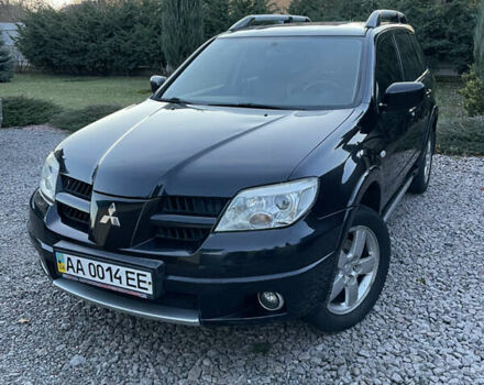 Черный Мицубиси Аутлендер, объемом двигателя 2.38 л и пробегом 118 тыс. км за 6850 $, фото 1 на Automoto.ua