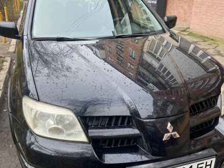 Міцубісі Аутлендер 2007 у Млынове на Automoto.ua Чорний Міцубісі Аутлендер, об'ємом двигуна 2 л та пробігом 227 тис. км за 5800 $, фото 1 на Automoto.ua