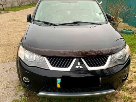 Черный Мицубиси Аутлендер, объемом двигателя 3 л и пробегом 256 тыс. км за 8500 $, фото 1 на Automoto.ua