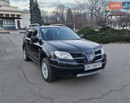 Чорний Міцубісі Аутлендер, об'ємом двигуна 2 л та пробігом 290 тис. км за 4500 $, фото 1 на Automoto.ua
