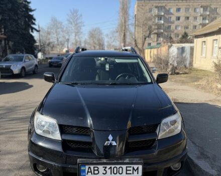 Черный Мицубиси Аутлендер, объемом двигателя 2.4 л и пробегом 320 тыс. км за 6000 $, фото 1 на Automoto.ua