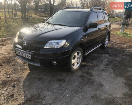 Чорний Міцубісі Аутлендер, об'ємом двигуна 2.4 л та пробігом 260 тис. км за 7200 $, фото 1 на Automoto.ua