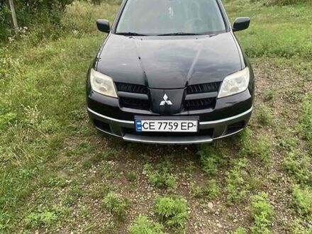 Мицубиси Аутлендер 2007 в Черновцах на Automoto.ua Черный Мицубиси Аутлендер, объемом двигателя 2 л и пробегом 100 тыс. км за 5200 $, фото 1 на Automoto.ua