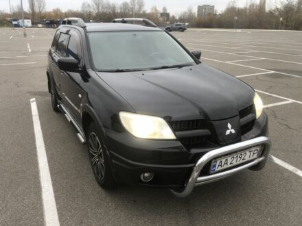 Черный Мицубиси Аутлендер, объемом двигателя 2.4 л и пробегом 314 тыс. км за 5000 $, фото 1 на Automoto.ua