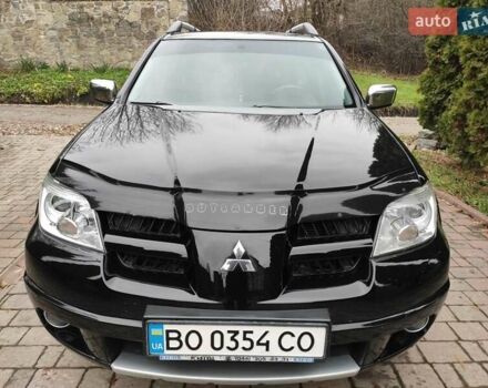 Черный Мицубиси Аутлендер, объемом двигателя 2 л и пробегом 180 тыс. км за 6000 $, фото 1 на Automoto.ua