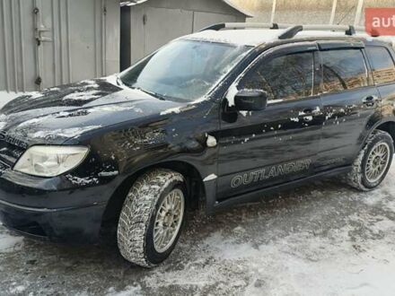 Черный Мицубиси Аутлендер, объемом двигателя 2 л и пробегом 290 тыс. км за 4850 $, фото 1 на Automoto.ua