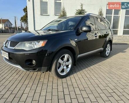 Черный Мицубиси Аутлендер, объемом двигателя 2.4 л и пробегом 234 тыс. км за 7400 $, фото 1 на Automoto.ua