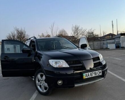 Черный Мицубиси Аутлендер, объемом двигателя 2.38 л и пробегом 147 тыс. км за 7200 $, фото 1 на Automoto.ua