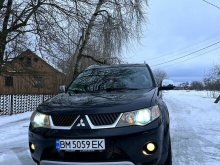 Черный Мицубиси Аутлендер, объемом двигателя 2 л и пробегом 290 тыс. км за 10000 $, фото 1 на Automoto.ua