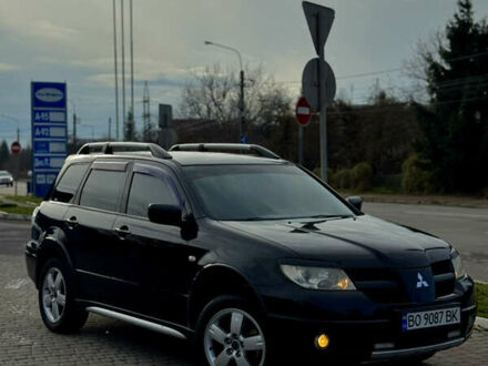 Черный Мицубиси Аутлендер, объемом двигателя 2 л и пробегом 280 тыс. км за 7500 $, фото 1 на Automoto.ua