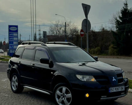 Черный Мицубиси Аутлендер, объемом двигателя 2 л и пробегом 280 тыс. км за 7500 $, фото 1 на Automoto.ua
