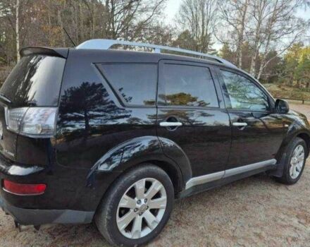 Черный Мицубиси Аутлендер, объемом двигателя 2 л и пробегом 236 тыс. км за 4419 $, фото 1 на Automoto.ua