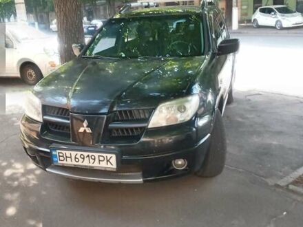 Черный Мицубиси Аутлендер, объемом двигателя 2.38 л и пробегом 248 тыс. км за 7000 $, фото 1 на Automoto.ua
