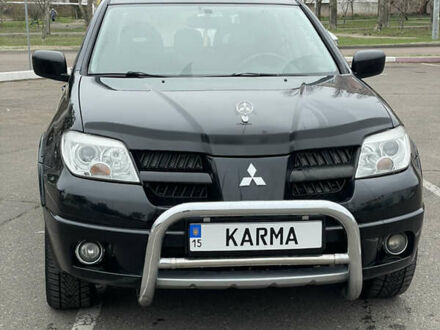 Чорний Міцубісі Аутлендер, об'ємом двигуна 2.38 л та пробігом 198 тис. км за 7100 $, фото 1 на Automoto.ua