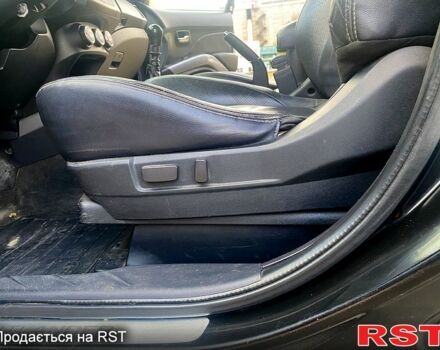 Черный Мицубиси Аутлендер, объемом двигателя 2 л и пробегом 207 тыс. км за 8100 $, фото 1 на Automoto.ua