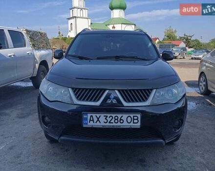 Черный Мицубиси Аутлендер, объемом двигателя 2.36 л и пробегом 218 тыс. км за 7500 $, фото 1 на Automoto.ua