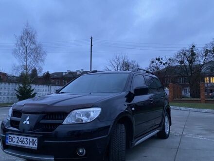 Черный Мицубиси Аутлендер, объемом двигателя 2 л и пробегом 271 тыс. км за 6799 $, фото 1 на Automoto.ua