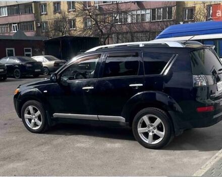 Черный Мицубиси Аутлендер, объемом двигателя 2.4 л и пробегом 220 тыс. км за 12000 $, фото 1 на Automoto.ua