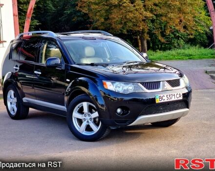 Черный Мицубиси Аутлендер, объемом двигателя 2.4 л и пробегом 189 тыс. км за 7000 $, фото 1 на Automoto.ua