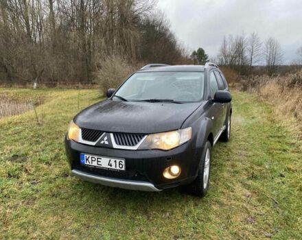 Черный Мицубиси Аутлендер, объемом двигателя 2 л и пробегом 320 тыс. км за 4200 $, фото 1 на Automoto.ua