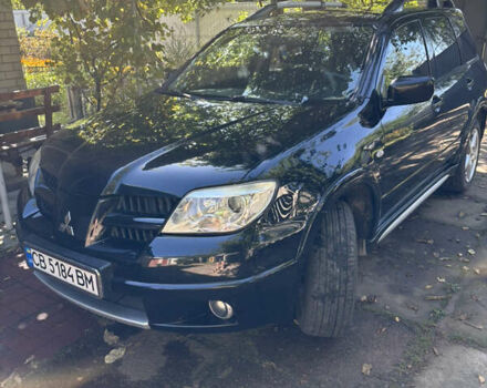 Чорний Міцубісі Аутлендер, об'ємом двигуна 2 л та пробігом 228 тис. км за 7300 $, фото 1 на Automoto.ua